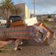Acumulación de basura y muebles en la calle de Melilla