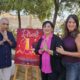 Celebración del Diwali en Melilla con personas y cartel del evento.