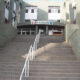 Escalera de acceso al IES Rusadir con barandillas blancas