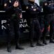 Agentes de la Policía Nacional en Melilla junto a una furgoneta policial