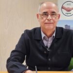 Retrato de un representante de CPM discutiendo sobre precios y medidas gubernamentales.