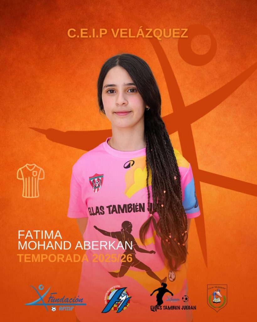 Portrait of Fatima Mohand Aberkan in a pink sports jersey against an orange backdrop with team logos and season 2025/26.