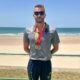 Miguel Ángel Rozas con medallas en la playa tras campeonato militar