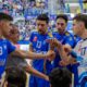 Entrenador Salim Abdelkader y jugadoras del Club Voleibol Melilla con trofeo en el Pabellón Javier Imbroda