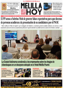 Front page of Melilla Hoy newspaper; main photo shows a panel discussion at a conference in Hotel Melilla Puerto addressing cybersecurity risks.