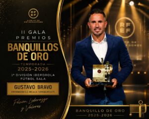 Man in a blue blazer holding a gold trophy at an awards gala with black-gold backdrop and bold text on the left panel