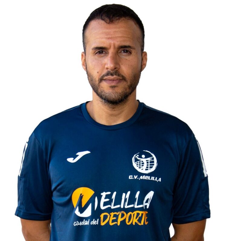 Portrait of a man wearing a blue sports jersey with Melilla logo, facing the camera.