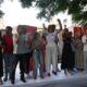 Grupo de personas aplaudiendo en un evento político en Melilla