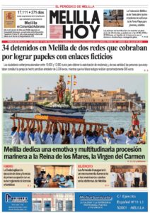 Melilla: devout helpers carry a boat bearing a statue of the Virgin of Carmen during a maritime procession by the harbor.