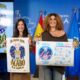 Dos mujeres sosteniendo carteles sobre la feria libre de violencias machistas