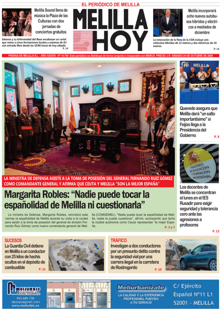 Minister of Defense Margarita Robles chairs the oath-taking of a new general in a formal room with military officers present behind her, Spain flag visible.